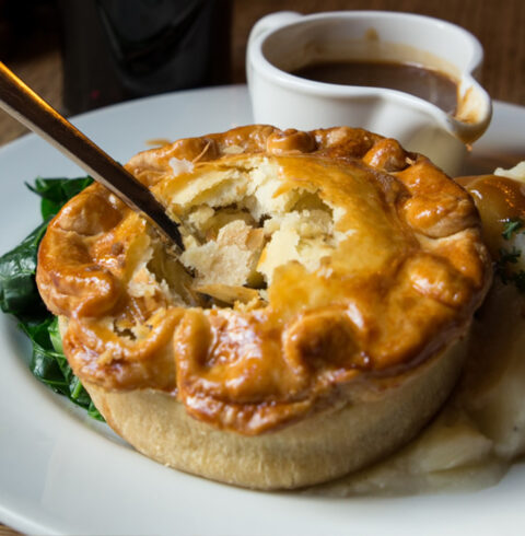 Pie and Mash on a table with Gravy