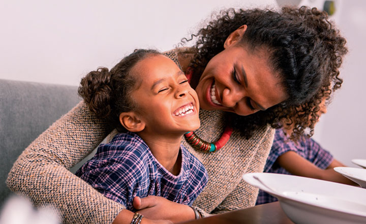 mum and daughter laughing