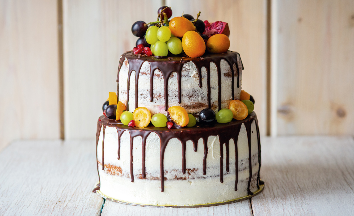 Tiered drip cake with fresh fruit