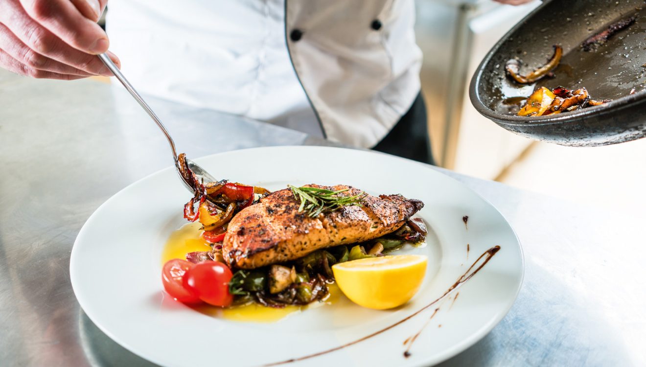 Chef plating up dish