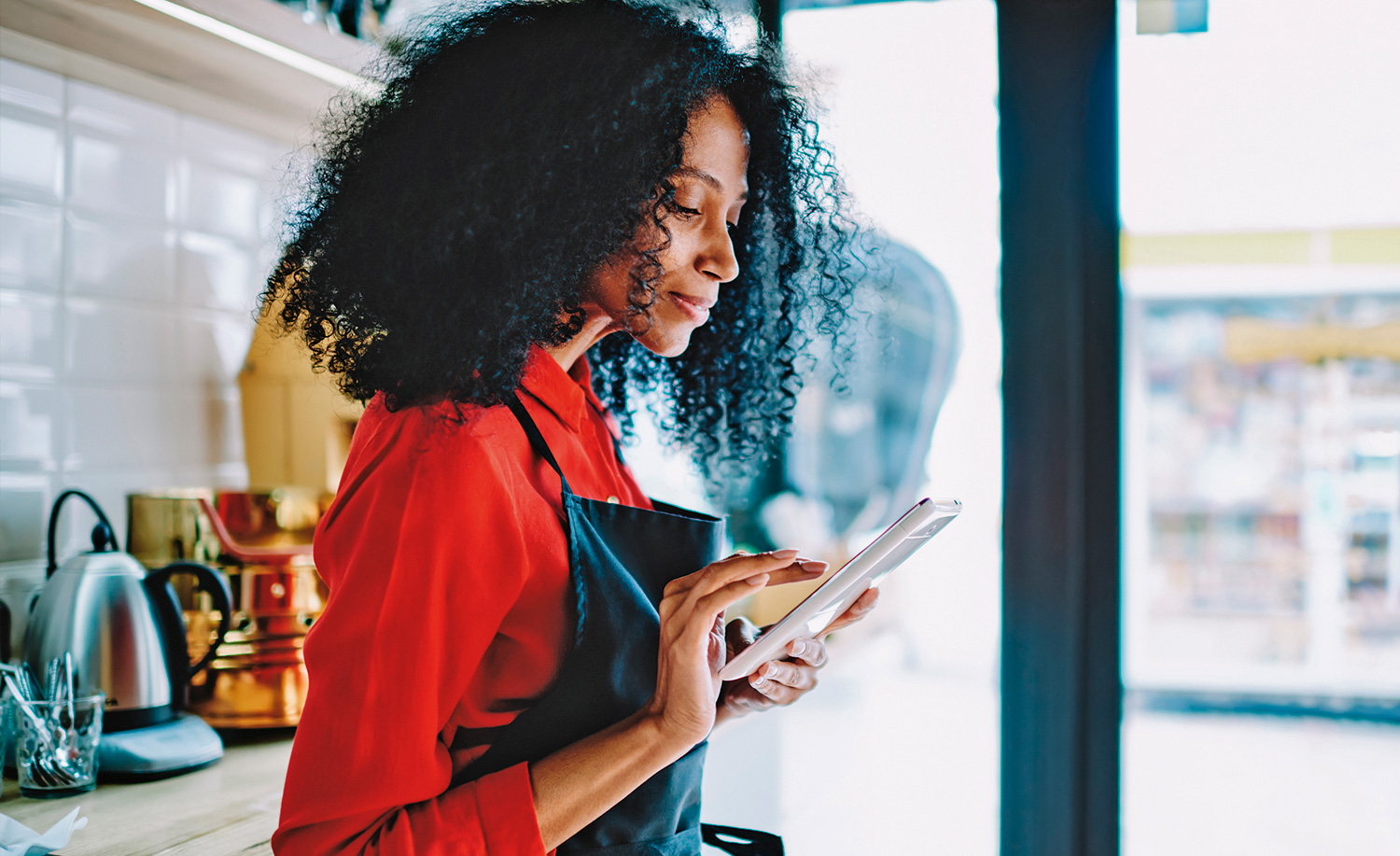 Waitress looking at tablet