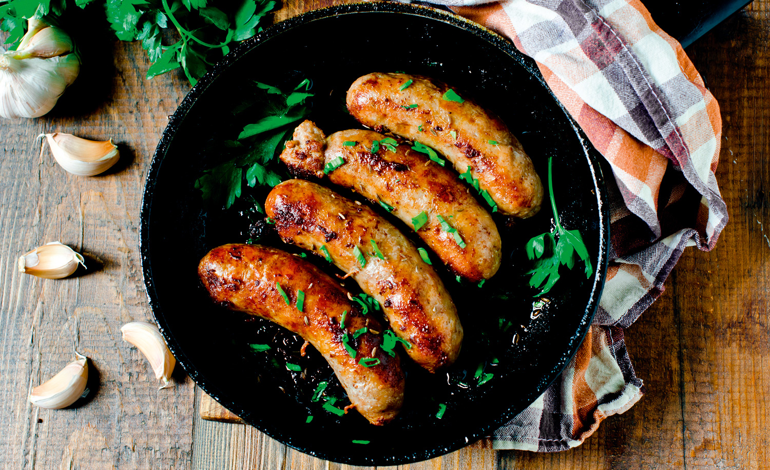 Sausages in frying pan