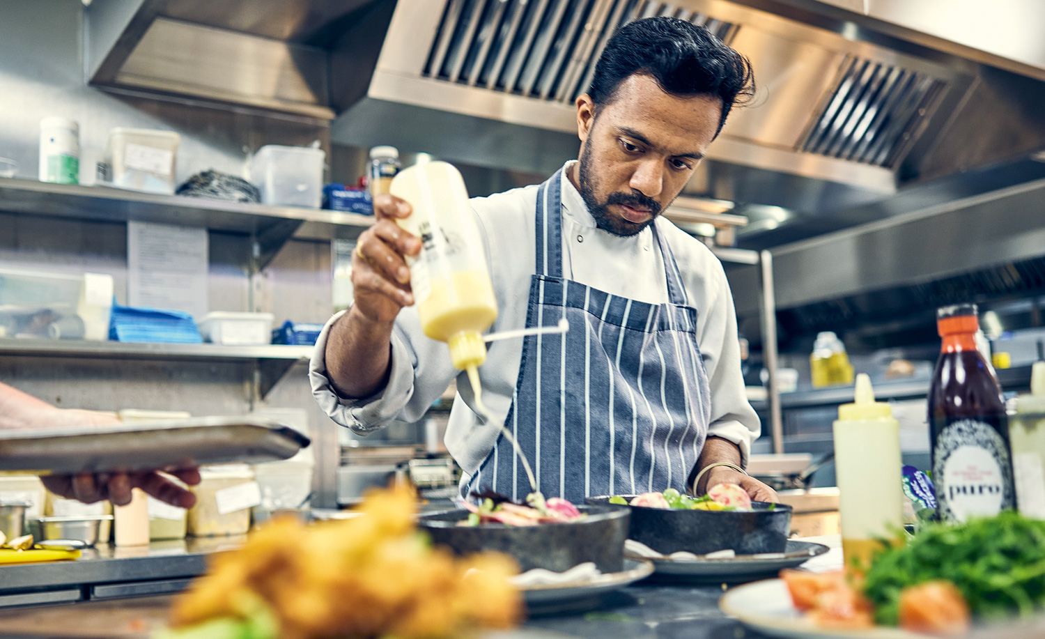 Chef at The Bear Hotel prepping dishes