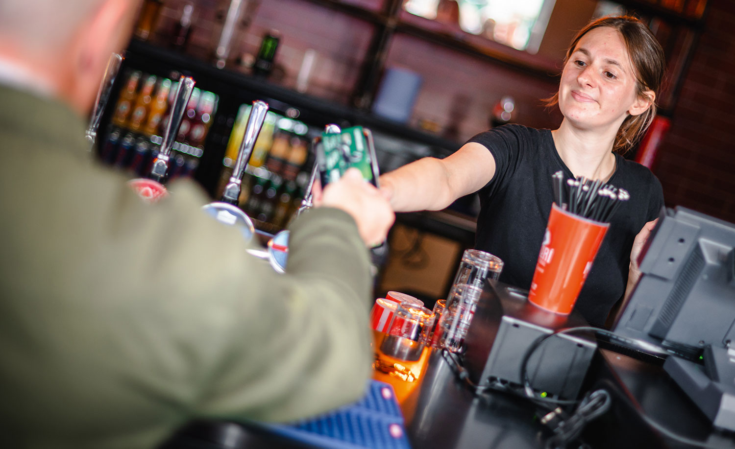 Customer paying at The Trent Navigation in Nottingham