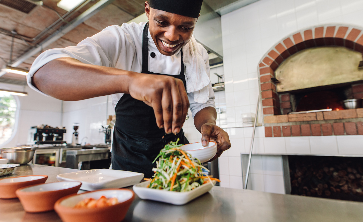 Chef adding the finishing touches to a dish