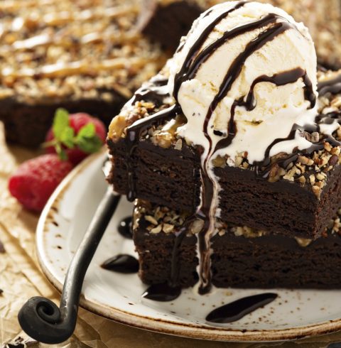 A slice of chocolate cake with rasberries